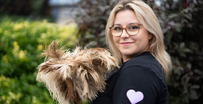 girl-holding-feather-duster