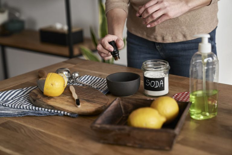 unrecognizable-person-adding-essential-oil-to-the