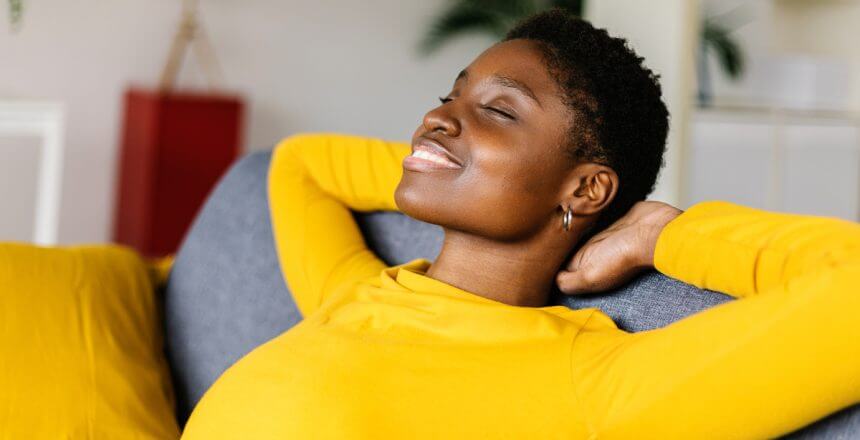 young-african-american-woman-relaxing-on-a-sofa